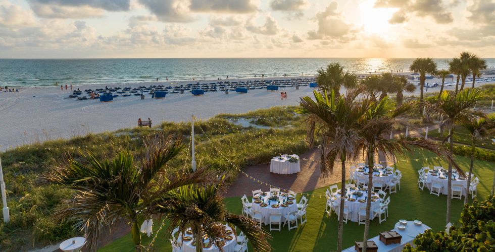 A Beach With Tables And Chairs