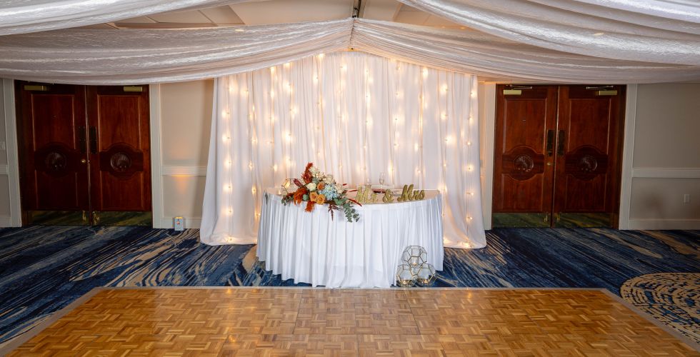 A Room With A Table And Flowers