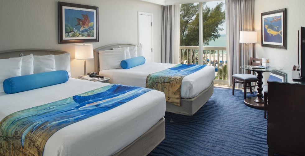 A Bedroom With A Large Bed In A Hotel Room