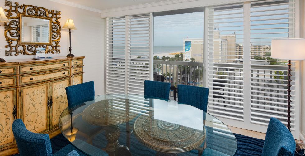 A Living Room Filled With Furniture And A Large Window