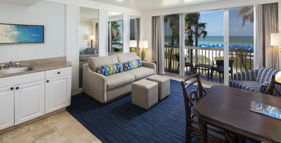 A Living Room Filled With Furniture And A Large Window