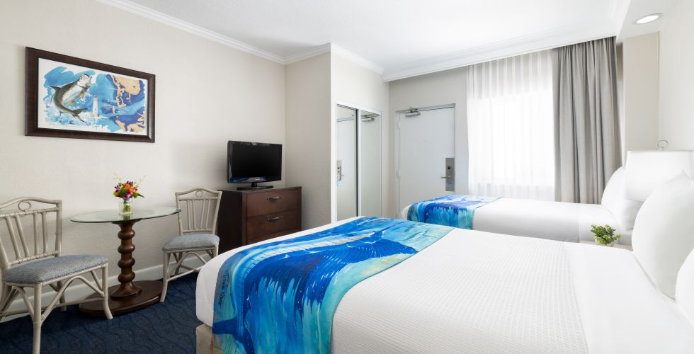 A Bedroom With A Bed And A Tv