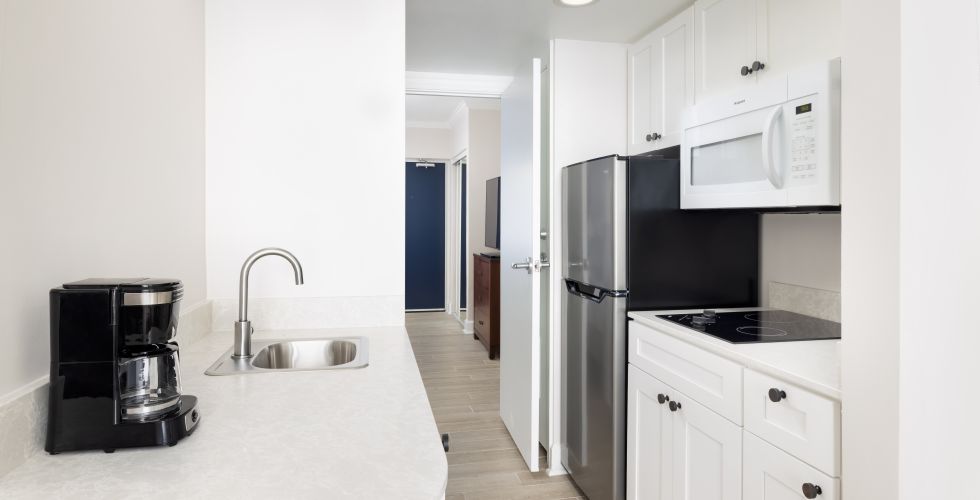 A Kitchen With White Cabinets