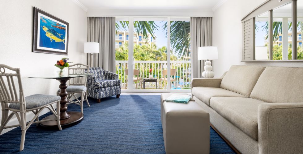 A Living Room With A Blue Rug