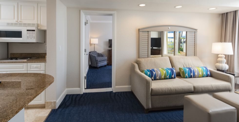 A Living Room Filled With Furniture And A Large Window